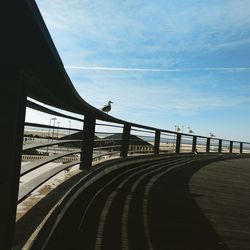 Bridge over road against sky