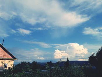 Scenic view of landscape against cloudy sky