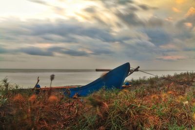 Scenic view of sea against cloudy sky