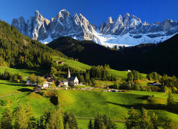 Scenic view of landscape and mountains against clear sky