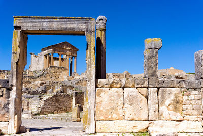 Old ruin building against blue sky