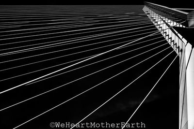 Low angle view of suspension bridge against sky