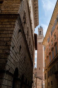 Low angle view of old buildings against sky