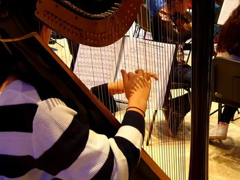 High angle view of man playing piano