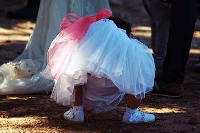 Low section of woman wearing shoes