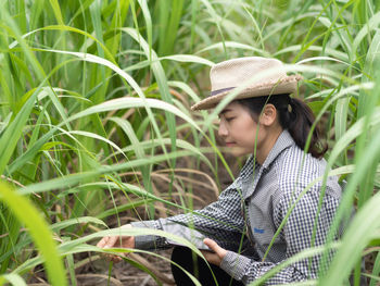 Young woman wearing hat on field