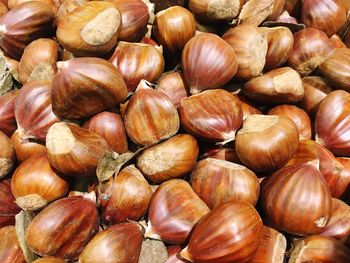 Full frame shot of hazelnuts for sale at market during sunny day