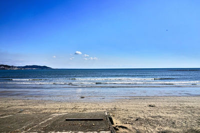 Scenic view of sea against blue sky