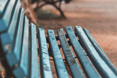 Close-up of bench in park