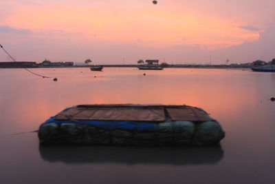 Scenic view of sea against sky at sunset