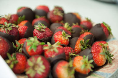 Close-up of strawberries with chocolates in plate