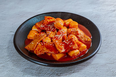 High angle view of chopped fruits in bowl on table