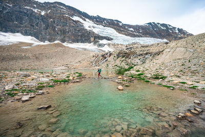 Crossing a glacial pond on iceline trail in yoho national park