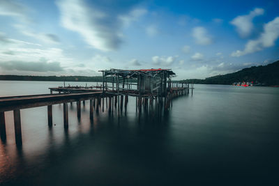 Pier over sea against sky