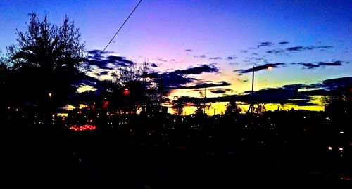 View of illuminated city at sunset