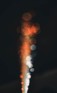 Defocused image of illuminated lights at night