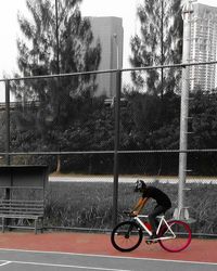 Man cycling on bicycle in city