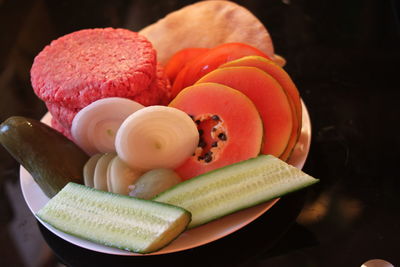 Close-up of fruit and vegetable slices on plate