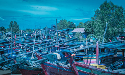 High angle view of worker working against blue sky