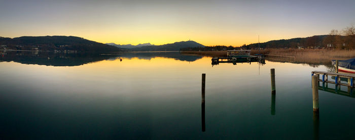 Scenic view of lake against sky during sunset