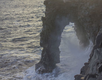 Scenic view of sea by cliff