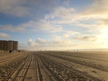 Sandy beach against sky