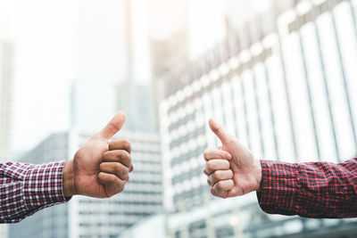 Midsection of man making face with text