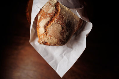 Fresh tasty french bread in paper