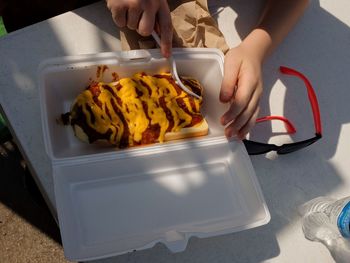 High angle view of woman preparing food on table