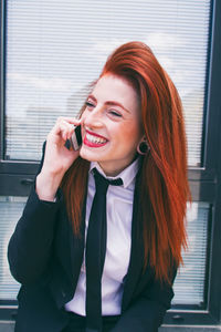 Smiling businesswoman talking on phone