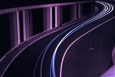 High angle view of light trails on road at night