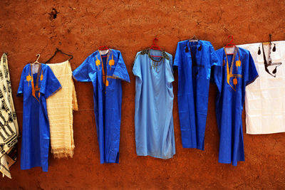 Clothes drying against blue wall