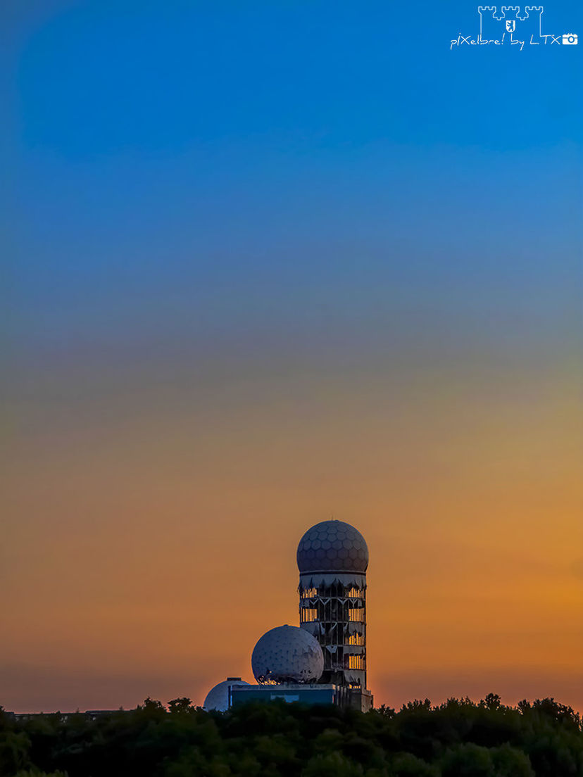 sunset, copy space, clear sky, built structure, building exterior, architecture, blue, orange color, field, landscape, sky, tranquility, scenics, nature, tower, tranquil scene, outdoors, beauty in nature, no people, dusk