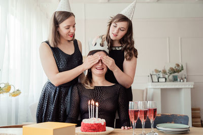 Happy women celebrating birthday at home