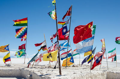 Various flags at salar de uyuni