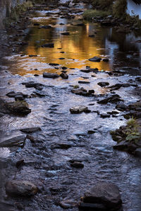 View of river flowing through rocks