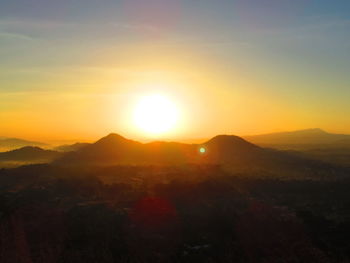 Scenic view of mountains at sunset