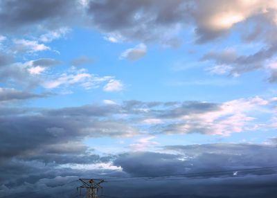 Low angle view of windmill against sky during sunset