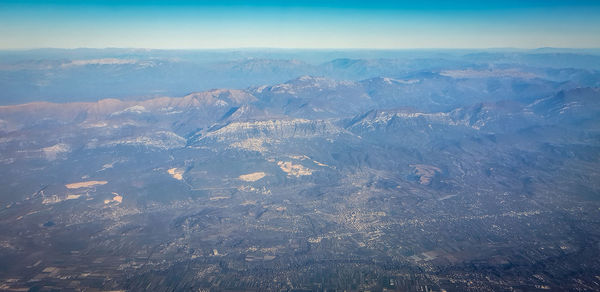 Aerial view of dramatic landscape against sky