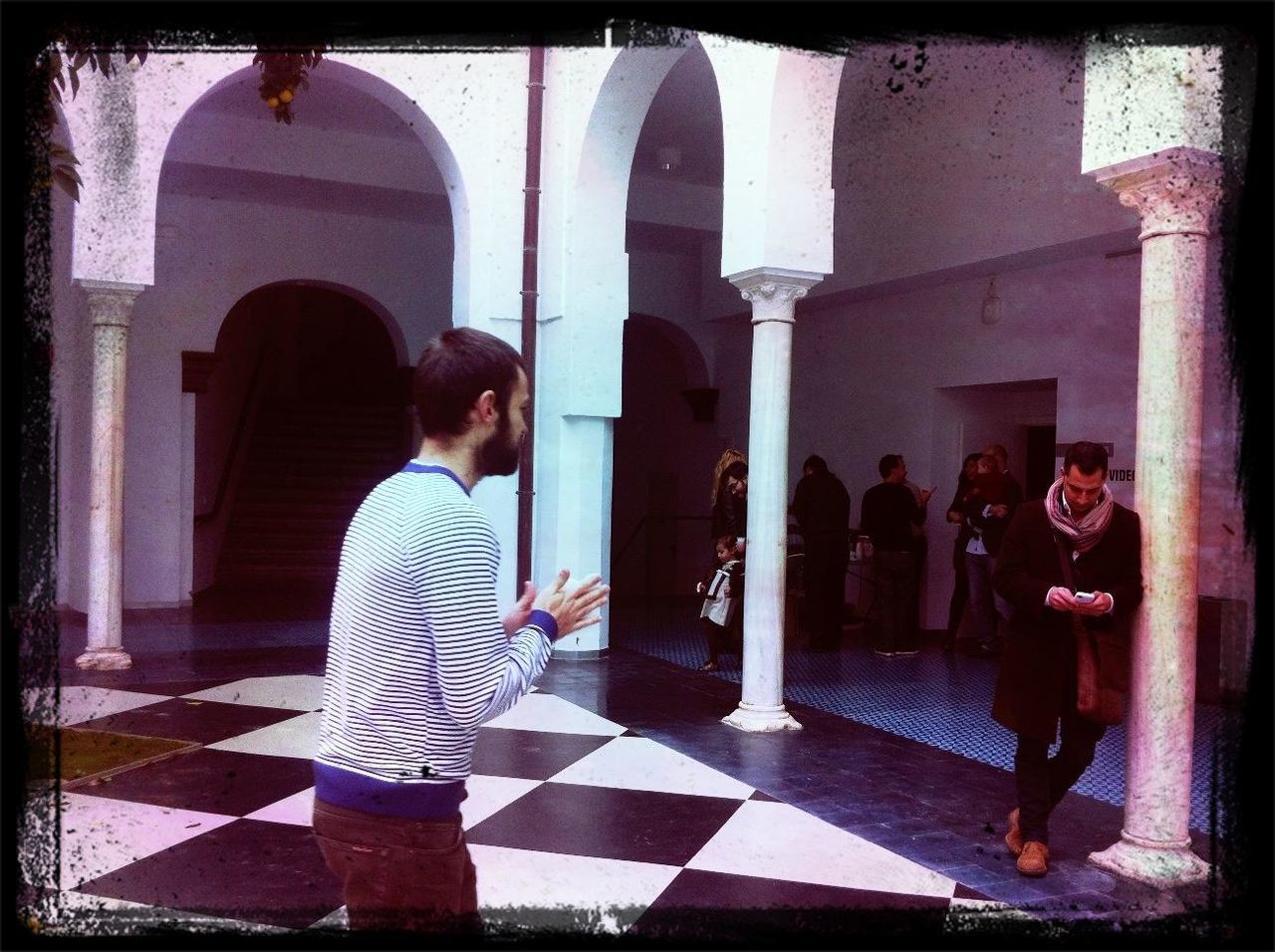 lifestyles, architecture, full length, standing, built structure, casual clothing, leisure activity, building exterior, person, indoors, togetherness, rear view, walking, bonding, love, front view, day