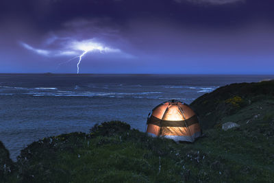 Scenic view of sea against sky at night