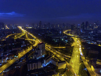High angle view of illuminated city buildings at night