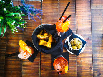 Directly above shot of food and drink on wooden table