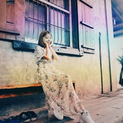 Portrait of woman sitting outdoors