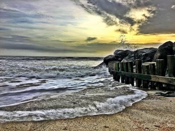 Scenic view of sea against cloudy sky