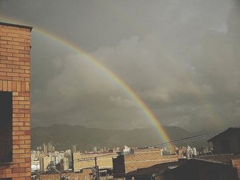 Rainbow over cloudy sky