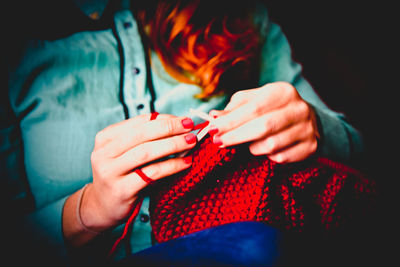 Close-up of woman knitting sweater