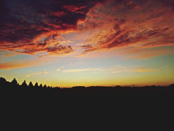 Silhouette of landscape against dramatic sky