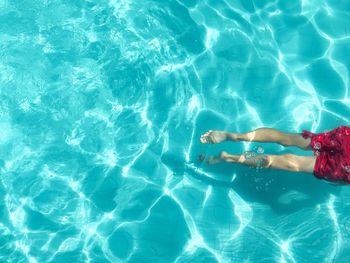 High angle view of woman swimming in pool