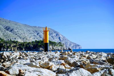 Scenic view of sea against clear blue sky